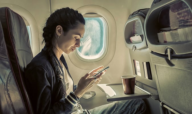 woman-sitting-on-plane