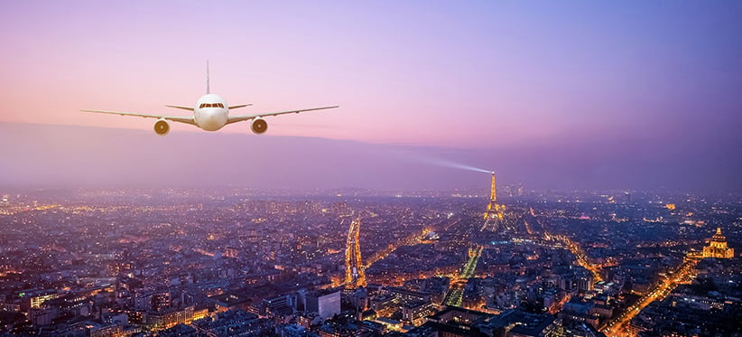 plane-over-paris-night