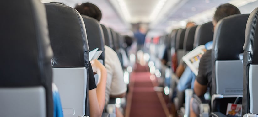 quicket-interior-of-plane-with-seated-passengers